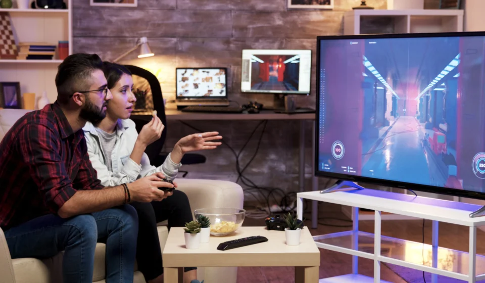 A vibrant montage of popular PS Plus games displayed across PlayStation 5 and PlayStation Plus tier interfaces.